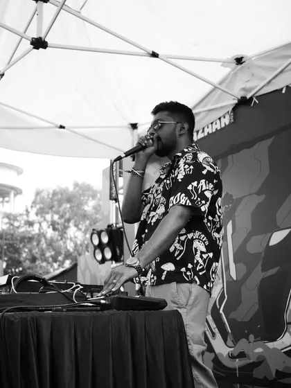 I beatbox and work the controls on the Bazaar street stage at Blend Bazaar 2023, captured in black and white.