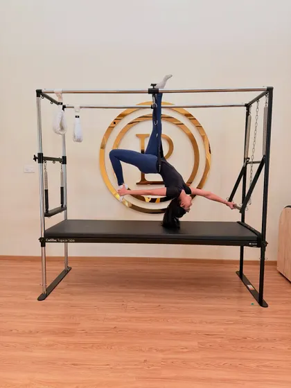 Ready to try something wild? The Cadillac allows for incredible movements like this inversion, which builds strength while decompressing the spine. It's as much about letting go as it is about holding on.