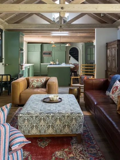 This shot from the Saratoga home highlights the beautiful Jaipur Rug that grounds the living space. Its rich texture and earthy hues complement the home's contemporary aesthetic while adding a soulful touch of India.