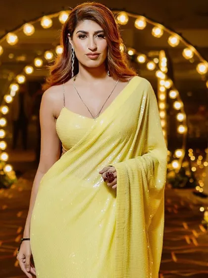 Stealing hearts with this look. Soft, beachy waves are the perfect complement to a chic and modern saree for a cocktail event.