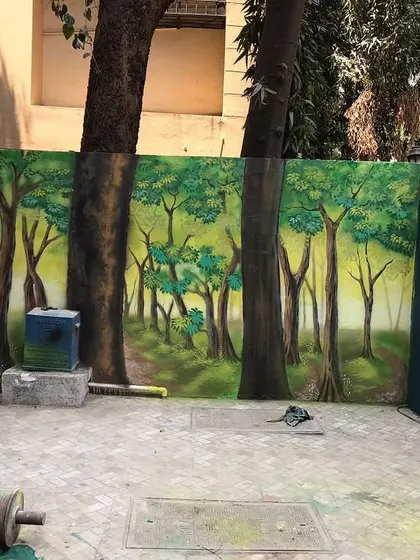 Another angle of the forest path mural, showing how it creates a sense of depth and tranquility in the outdoor area.