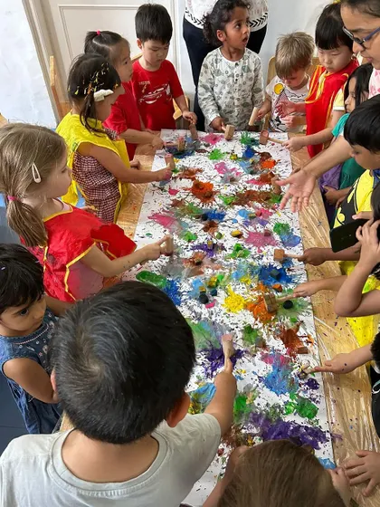 A collaborative art project for Holi, where all the children worked together to create a vibrant masterpiece.