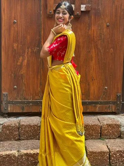 A full view of this stunning yellow saree, perfect for celebrating the first day of Navratri with style and grace.
