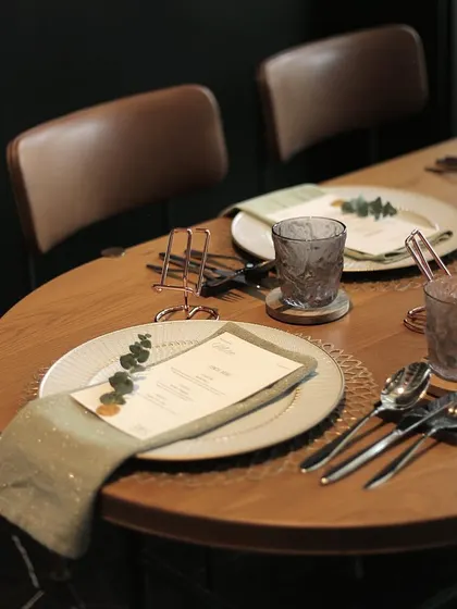 An elegantly set dining table, ready for a gathering. Our furniture provides the perfect canvas for creating memorable moments, combining timeless design with a touch of royalty.