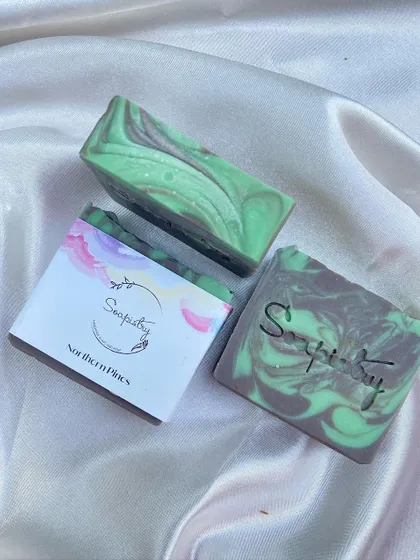The Northern Pines soap, with its fresh green and grey swirls, evokes the scent of a forest.