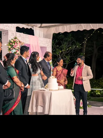 A full view of the cake cutting ceremony, a key part of any wedding reception or Sangeet that I host.