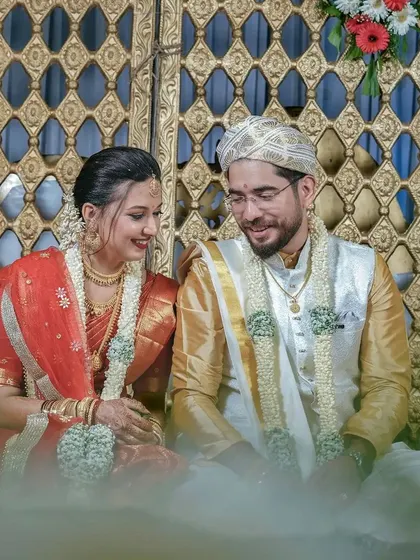 A dreamy, soft-focus shot of the couple during their ceremony, capturing a quiet moment of connection.