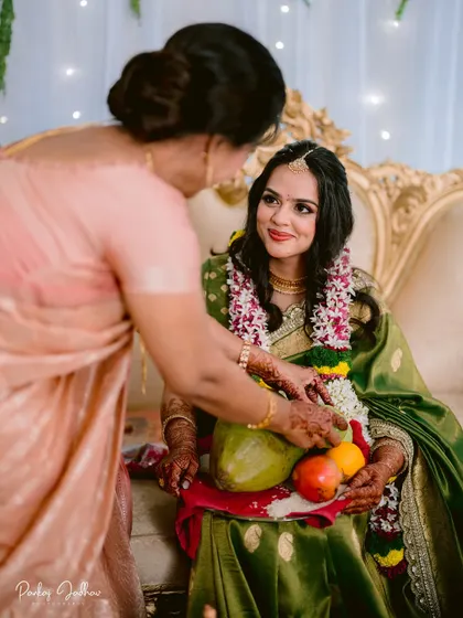 A mother's blessing. This touching moment during a traditional Maharashtrian engagement ceremony is full of emotion and cultural significance.