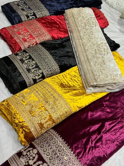 An assortment of my premium embroidered velvet fabrics laid out to show the variety. From deep navy and classic black to bold red and yellow, each is designed for creating statement pieces.