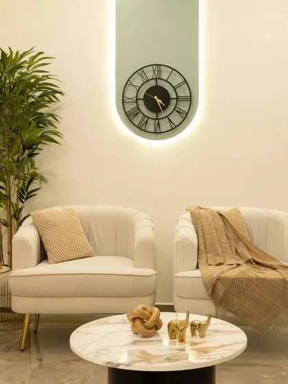 A corner of the Bren Zahara living room, where opulence meets calm. I combined plush beige armchairs, gold-legged tables, and a marble coffee table to create a haven of refined luxury.