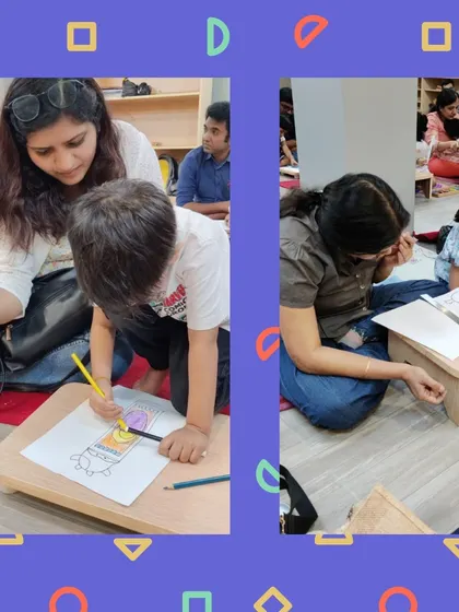 A parent and child work together, carefully coloring in their puppet design. These workshops are a great opportunity for bonding and creating something special together.