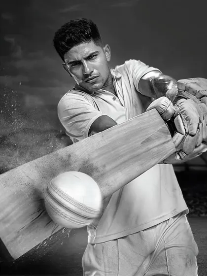 A powerful, dramatic shot of Shubman Gill for Engage by ITC. This black and white photo captures the intensity of a batsman in action, with the simple, classic cricket whites providing a timeless feel.