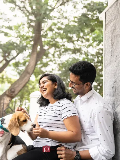 A happy family moment with their Beagle, Thunder. The joy and laughter in this photo are completely genuine.