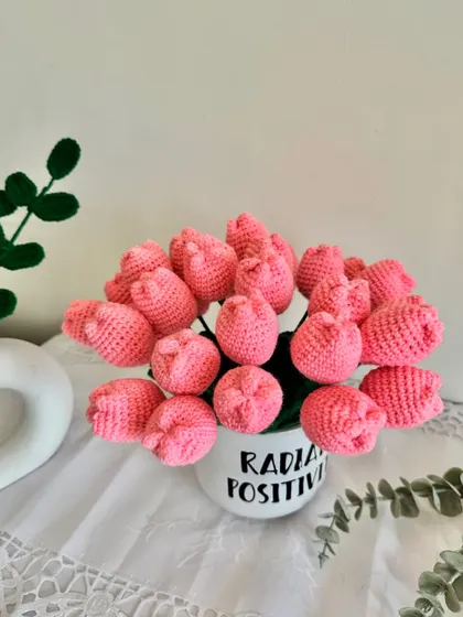 A top-down view of the pink crochet tulip bouquet, showing the cluster of beautiful handmade flowers.