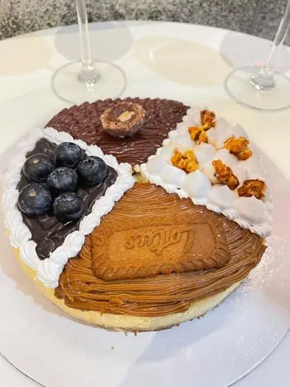 Another look at our popular four-flavour baked cheesecake, combining Nutella, blueberry, salted caramel, and Biscoff. It's a party on a plate, perfect for sharing or enjoying all by yourself.