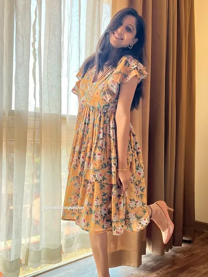 Another playful pose in the mustard yellow tiered dress. It’s a stunning piece that flows with grace and redefines elegance.