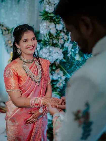 A beautiful, smiling portrait of the bride-to-be as she receives her engagement ring.
