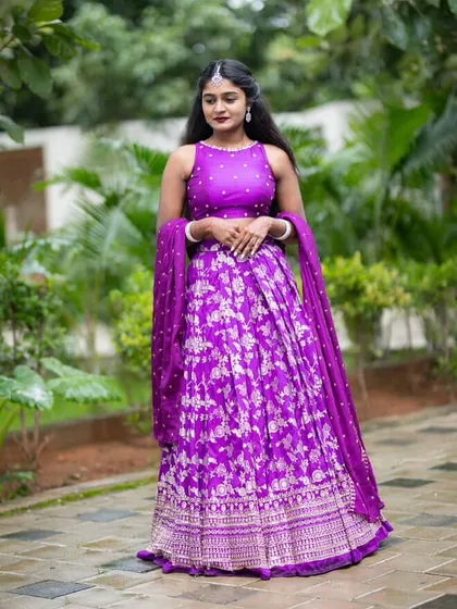 The complete look. This custom-stitched purple Banarasi lehenga with a matching dupatta is perfect for any festive occasion.