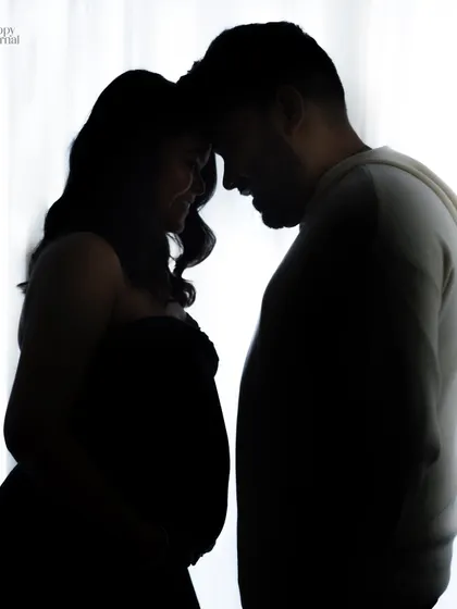 Another take on the couple's silhouette, this image is filled with quiet anticipation and love. The backlighting creates a dramatic and beautiful effect.