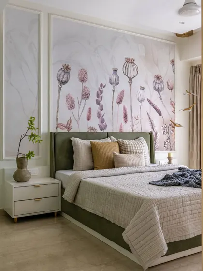 A full view of the sage green master bedroom, showing the elegant wall molding, custom wallpaper, and the seamless integration of a walk-in closet.