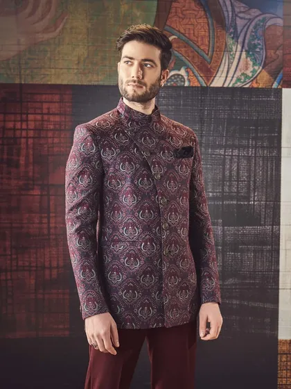 This deep maroon bandhgala with an asymmetrical cut and intricate paisley pattern is where heritage meets contemporary elegance, crafted to perfection.