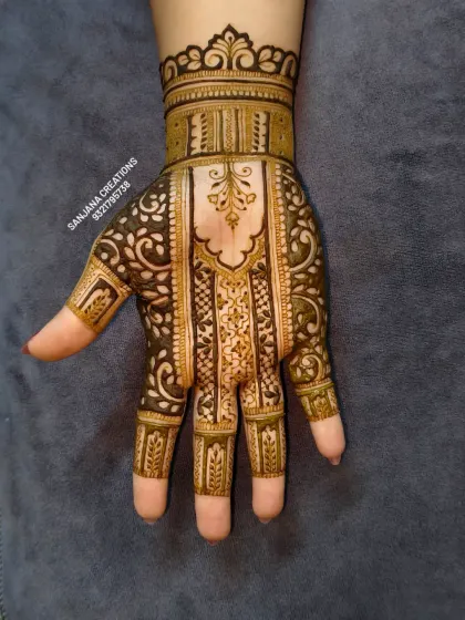 A gorgeous single-hand design that combines traditional patterns with a modern layout. It's detailed without being overwhelming.