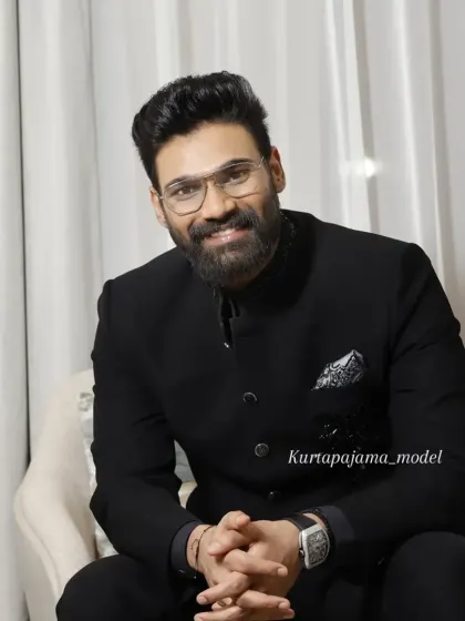 The same client smiling, showing the versatility of the Jodhpuri for both formal and more relaxed moments.