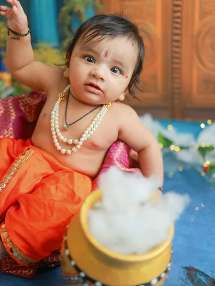 A wide-eyed and curious little Krishna. I love capturing these moments of wonder as babies explore the new textures and objects in the setup.
