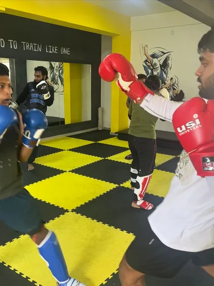 A snapshot from a boxing sparring session. Our fighters learn to maintain their guard, throw accurate punches, and move with purpose.