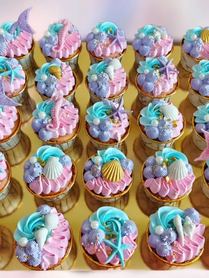 Dive into a magical celebration with these mermaid-themed cupcakes. I used pink, purple, and blue frosting and decorated each one with edible shells, starfish, and mermaid tails.