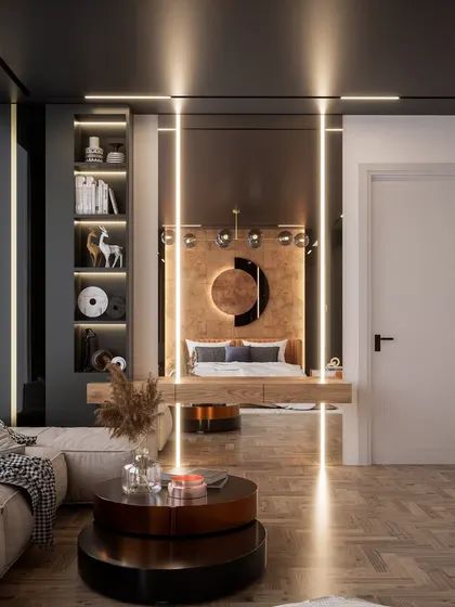 A different perspective of the same room, showing a built-in shelving unit and a cozy seating area. The mirrored wall behind the desk reflects light and adds a sense of glamour to the space.