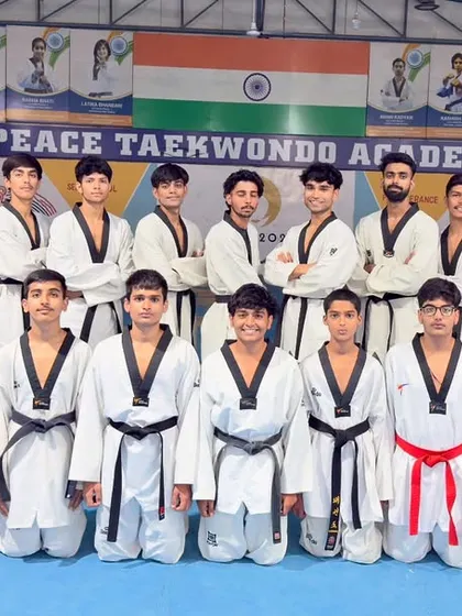 Our male athletes standing together for a team photo. This group represents a brotherhood of fighters who push each other to be their best every single day.