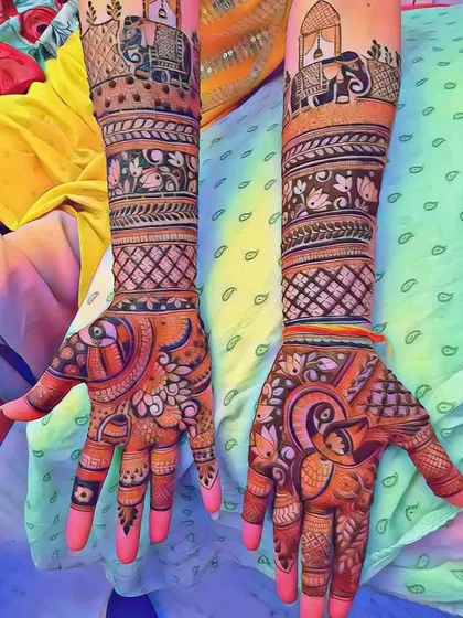 A vibrant design with elephants under a canopy on the forearms. The palms feature bold peacock and floral patterns, creating a rich and festive look.