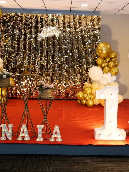 Another angle of the 13th birthday party, showing the full stage on a red carpet.