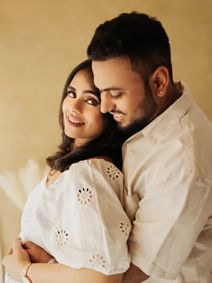 A tender and romantic moment from a lifestyle maternity shoot. The soft light and their close embrace create a beautiful and intimate portrait.