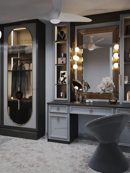A luxury dresser design in a sophisticated grey palette. The vanity features classic theatre-style lighting, gold accents, and a glass-fronted wardrobe, creating a glamorous and functional space.