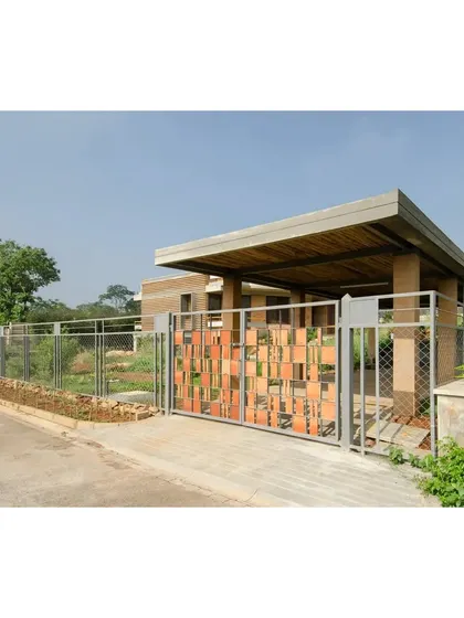 The entrance gate of the "Breathe" residence, which incorporates leftover CSEB blocks into its design. This detail reflects the project's commitment to using materials thoughtfully and minimizing waste.