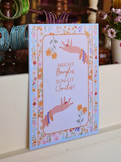 A welcome sign for the Mehendi, with the message 'Bright Bangles, Sun-lit Smiles!'.