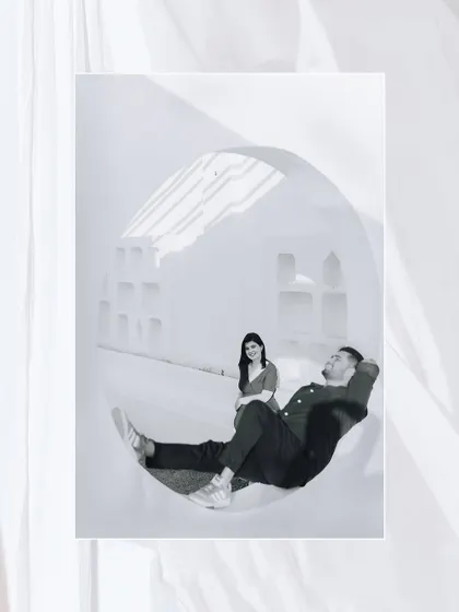 An artistic, playful shot using a large circular window as a frame, showcasing our creative approach to composition.