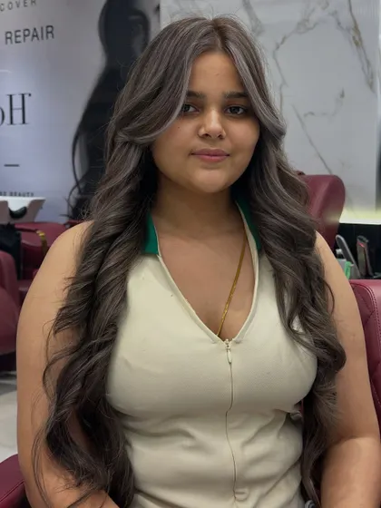 A fresh ash hair color for a fresh mood. The client was a first-timer and absolutely loved her new cool-toned look with face-framing highlights.