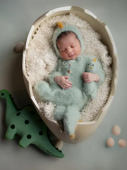 The cutest little dino boy. For this home shoot, we brought a prehistoric jungle to life with a fun dinosaur theme.
