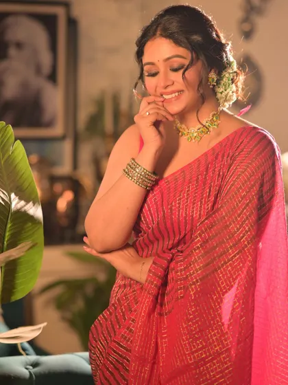 A candid shot of the model smiling, capturing a moment of genuine delight. This image feels spontaneous and adds a personal touch to the series.