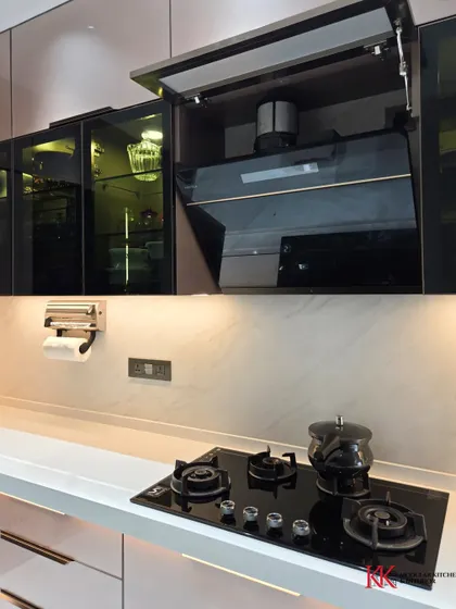 A look at the bi-fold lift-up shutter concealing the chimney pipe. This is how we create a clean, seamless look while maintaining full functionality of your appliances.