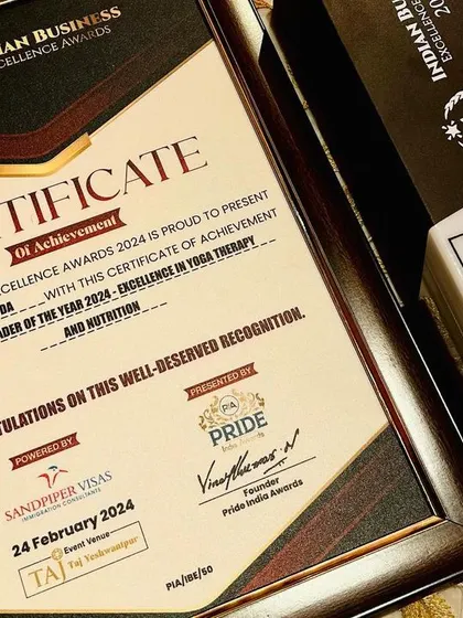 Another angle of the prestigious Indian Business Excellence Award. This award for 'Excellence in Yoga Therapy and Nutrition' is a significant professional achievement.