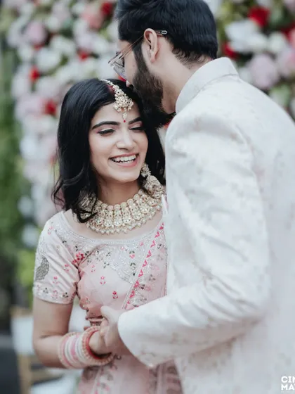 A close-up shot capturing a genuine, happy smile. The groom's tender gesture and the bride's joyful expression make this a perfect example of the candid moments I love to photograph.
