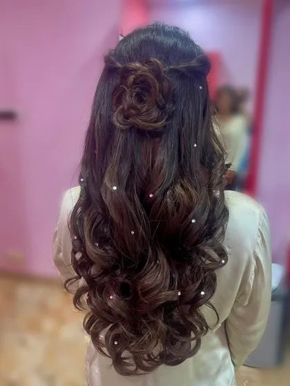 The back of the hair, highlighting the intricate hair rose and the scattered pearls on the waves.