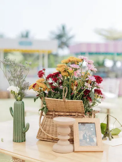 A cactus-shaped vase and a woven picnic basket add a touch of whimsy to the decor.