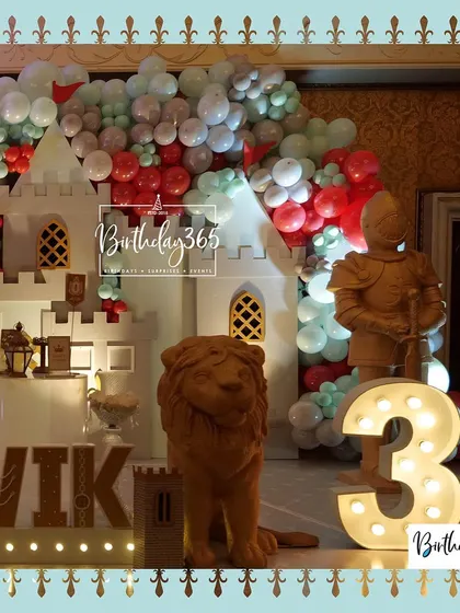 A close-up of the castle decor, featuring a golden lion statue and a large, light-up number "3".