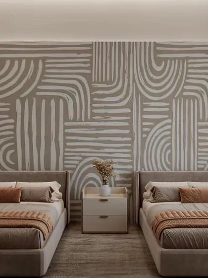 A calm and neutral bedroom with two single beds. The abstract-patterned accent wall adds a touch of modern artistry to the otherwise minimalist space.