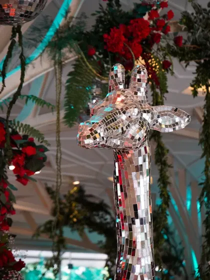 A close up of the disco ball giraffe, a key element of our 'Jungle Disco' theme. It’s quirky, memorable details like this that make a themed event truly special.